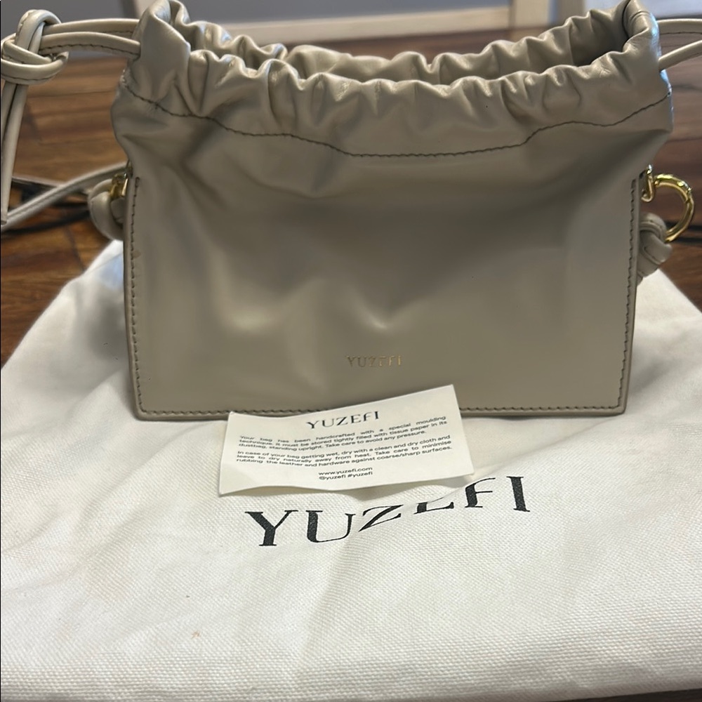Yuzefi Cream Crossbody Bag with Elegant Structure